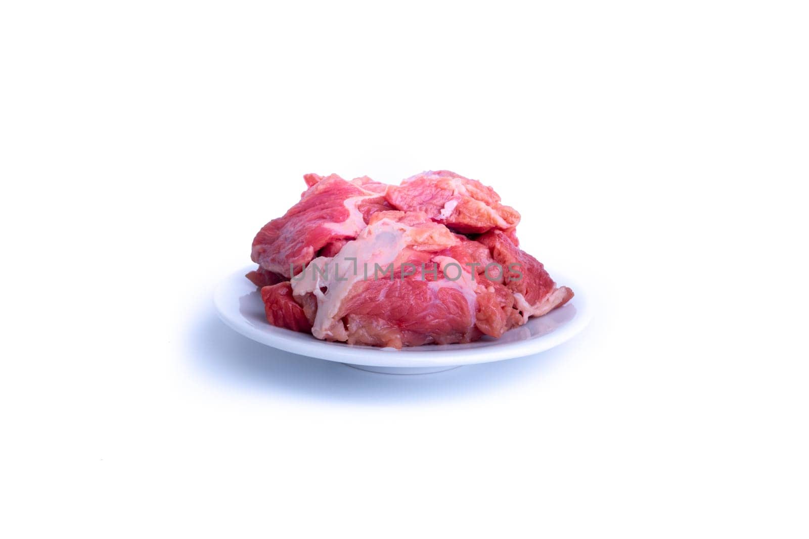 Fresh raw beef steak isolated on white background with selective focus