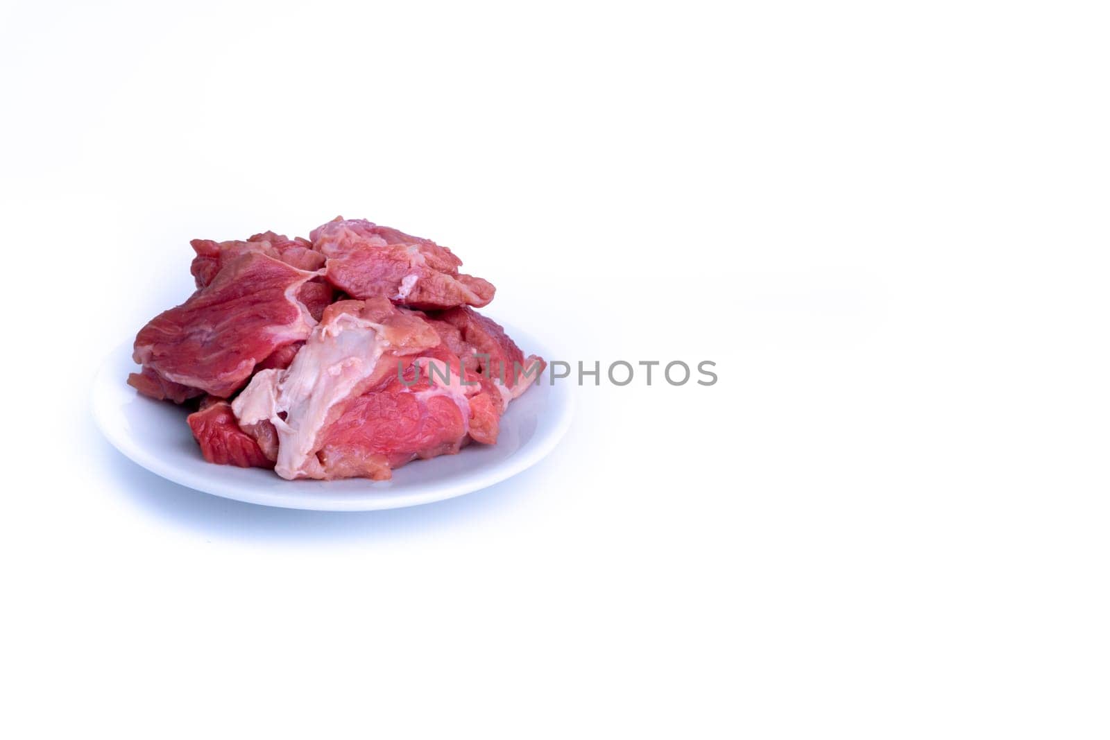 Fresh raw beef steak isolated on white background with selective focus