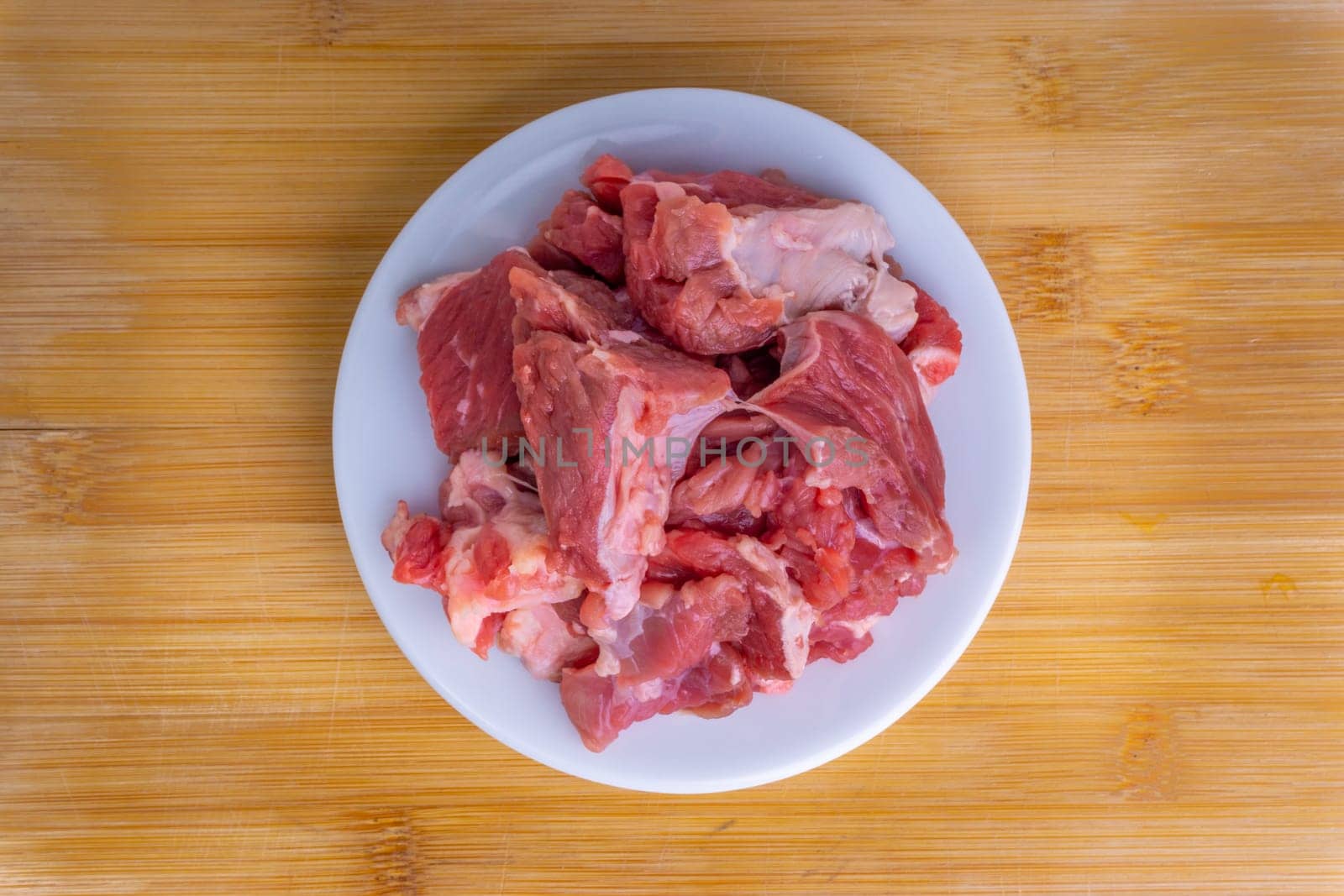 Fresh raw beef steak on wooden background with selective focus