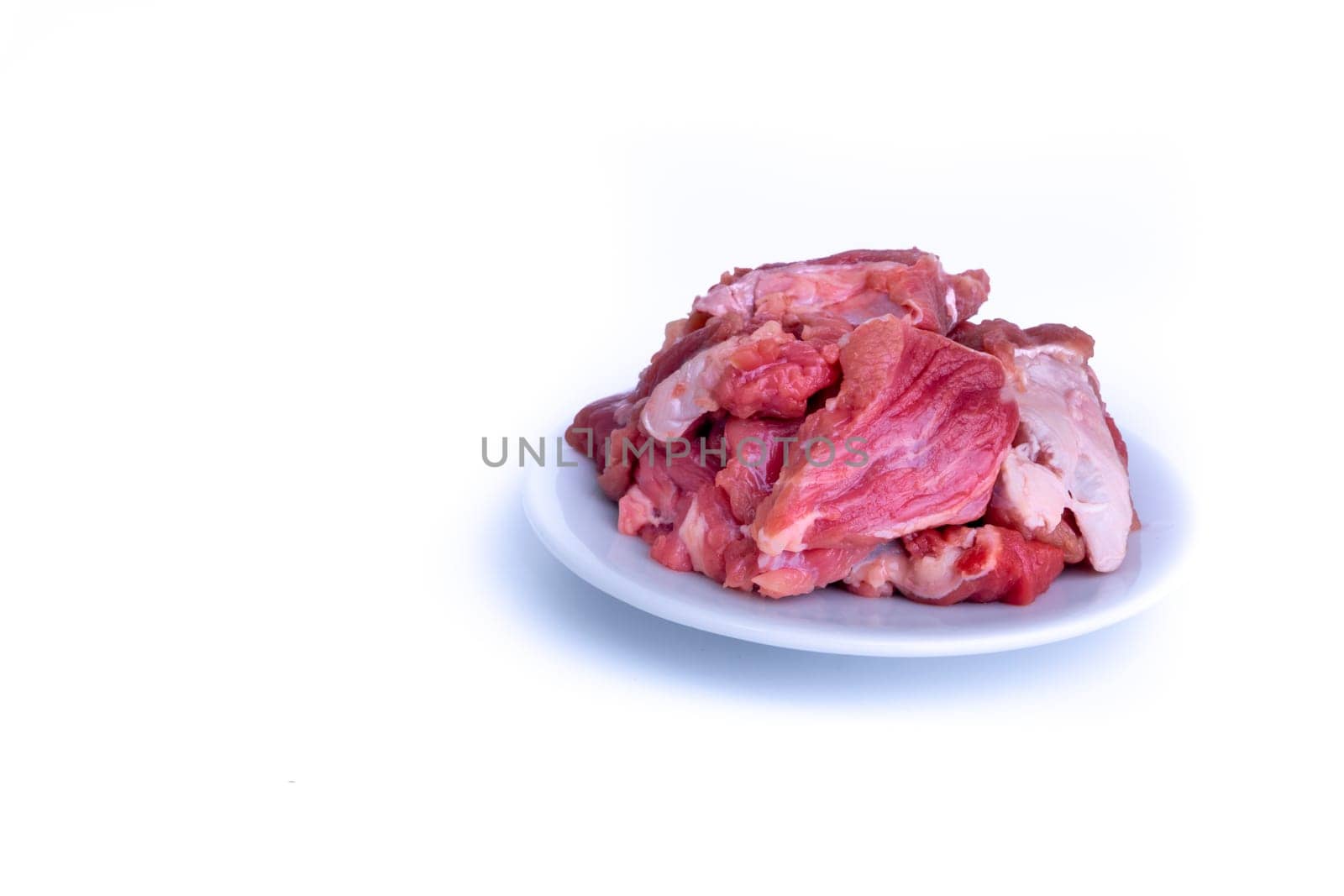 Fresh raw beef steak isolated on white background with selective focus
