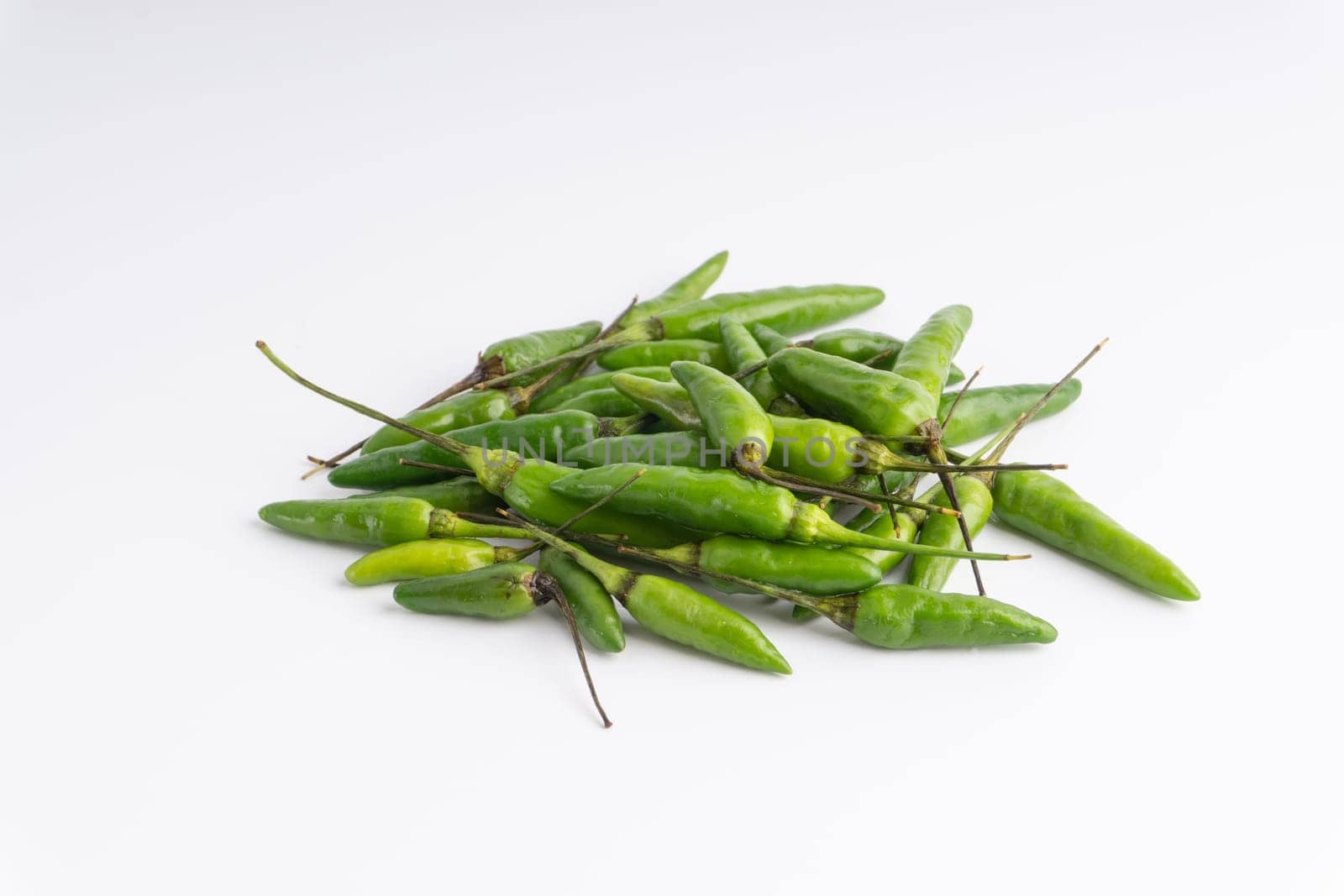 Green Bird’s eye chili,Thai Chili pepper ,bird chili pepper nature isolate on white background. Selective focus and crop fragment