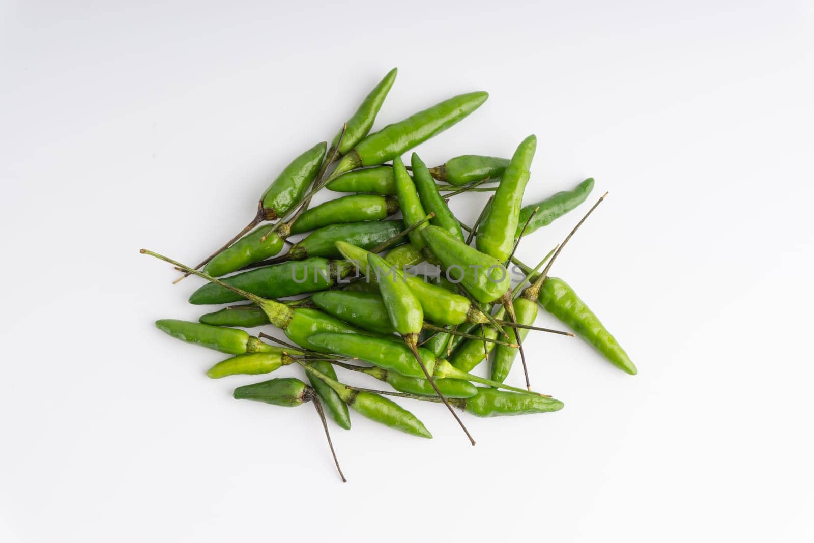 Green Bird’s eye chili,Thai Chili pepper ,bird chili pepper nature isolate on white background. Selective focus and crop fragment