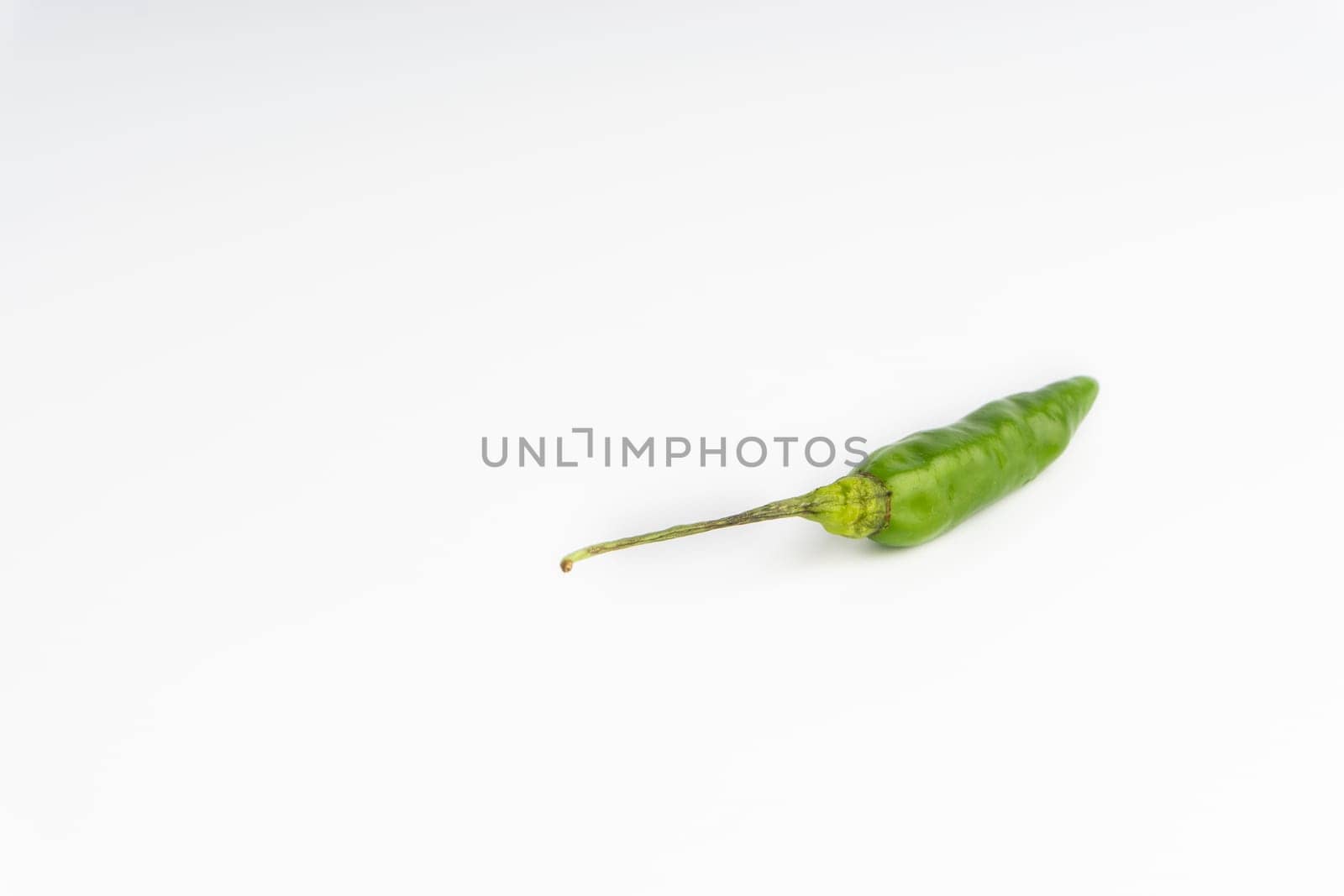 Green Bird’s eye chili,Thai Chili pepper ,bird chili pepper nature isolate on white background. Selective focus and crop fragment