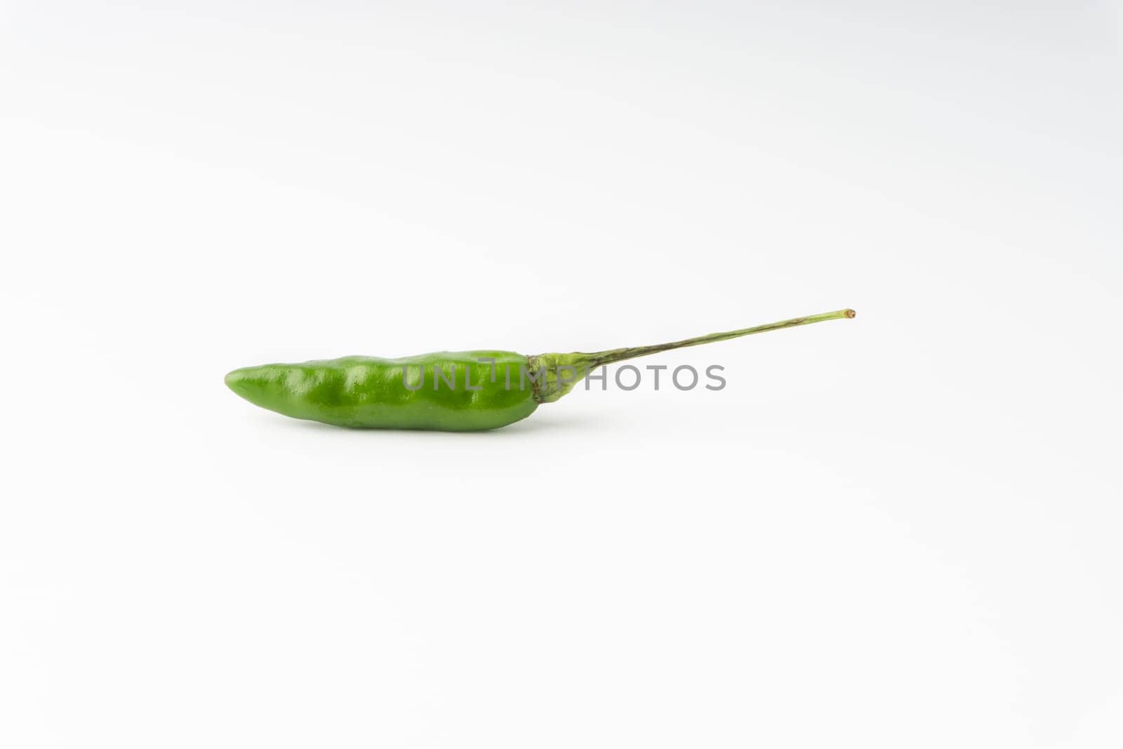 Green Bird’s eye chili,Thai Chili pepper ,bird chili pepper nature isolate on white background. Selective focus and crop fragment