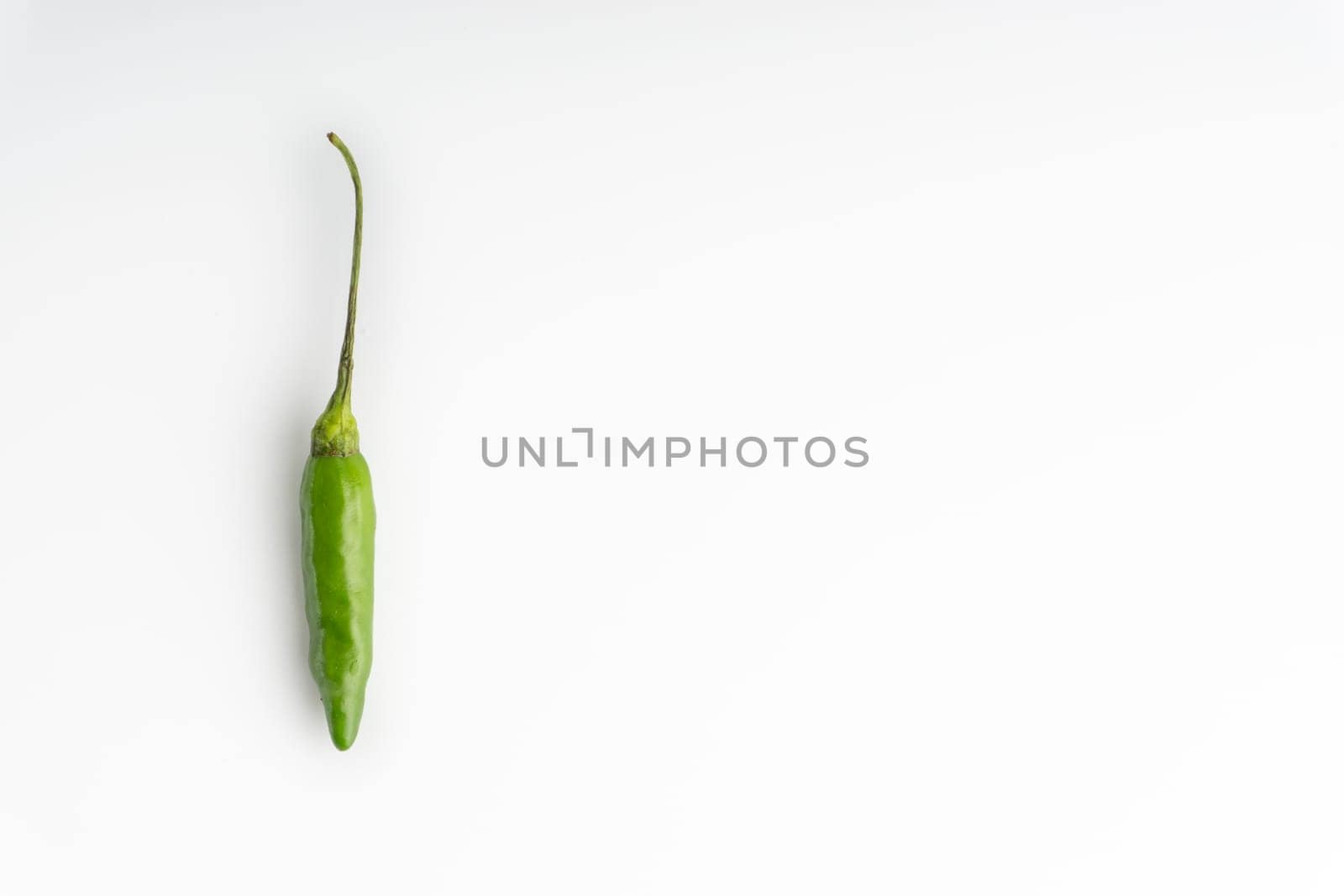 Green Bird’s eye chili,Thai Chili pepper ,bird chili pepper nature isolate on white background. Selective focus and crop fragment