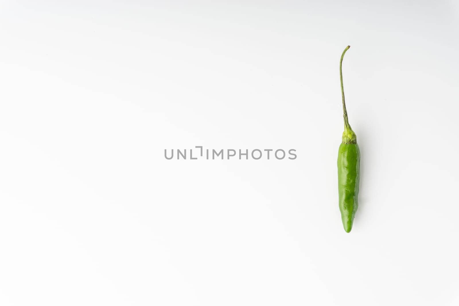 Green Bird’s eye chili,Thai Chili pepper ,bird chili pepper nature isolate on white background. Selective focus and crop fragment