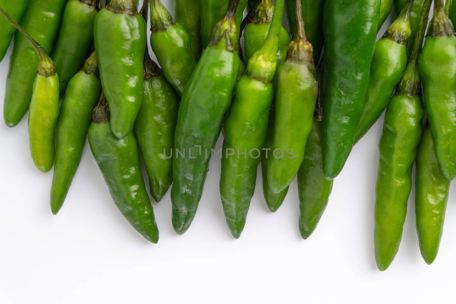 Green Bird’s eye chili,Thai Chili pepper ,bird chili pepper nature isolate on white background. Selective focus and crop fragment