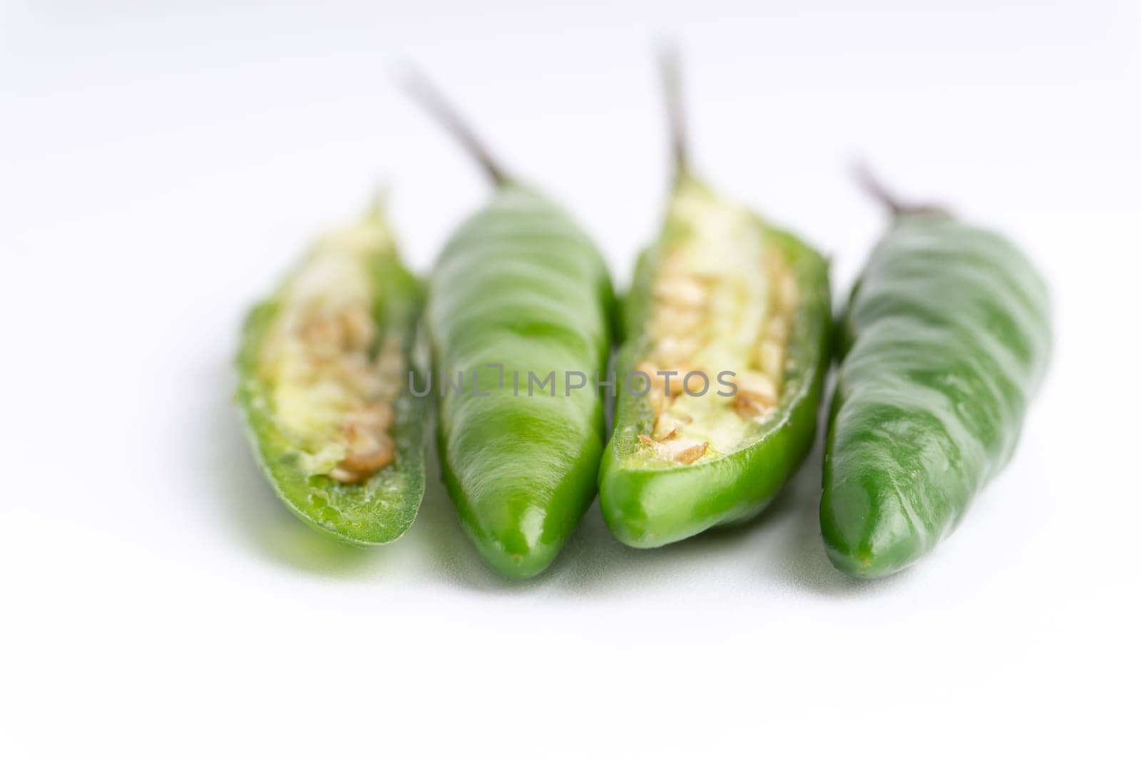 Green Bird’s eye chili,Thai Chili pepper ,bird chili pepper nature isolate on white background. Selective focus and crop fragment