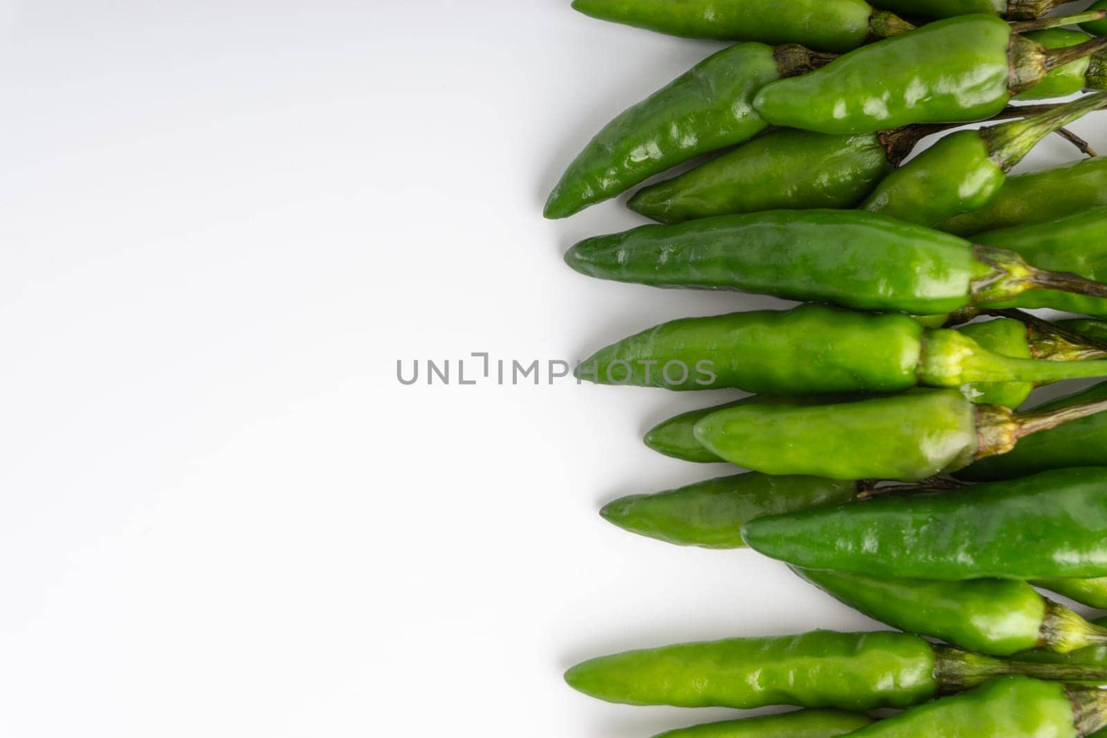 Green Bird’s eye chili,Thai Chili pepper ,bird chili pepper nature isolate on white background. Selective focus and crop fragment