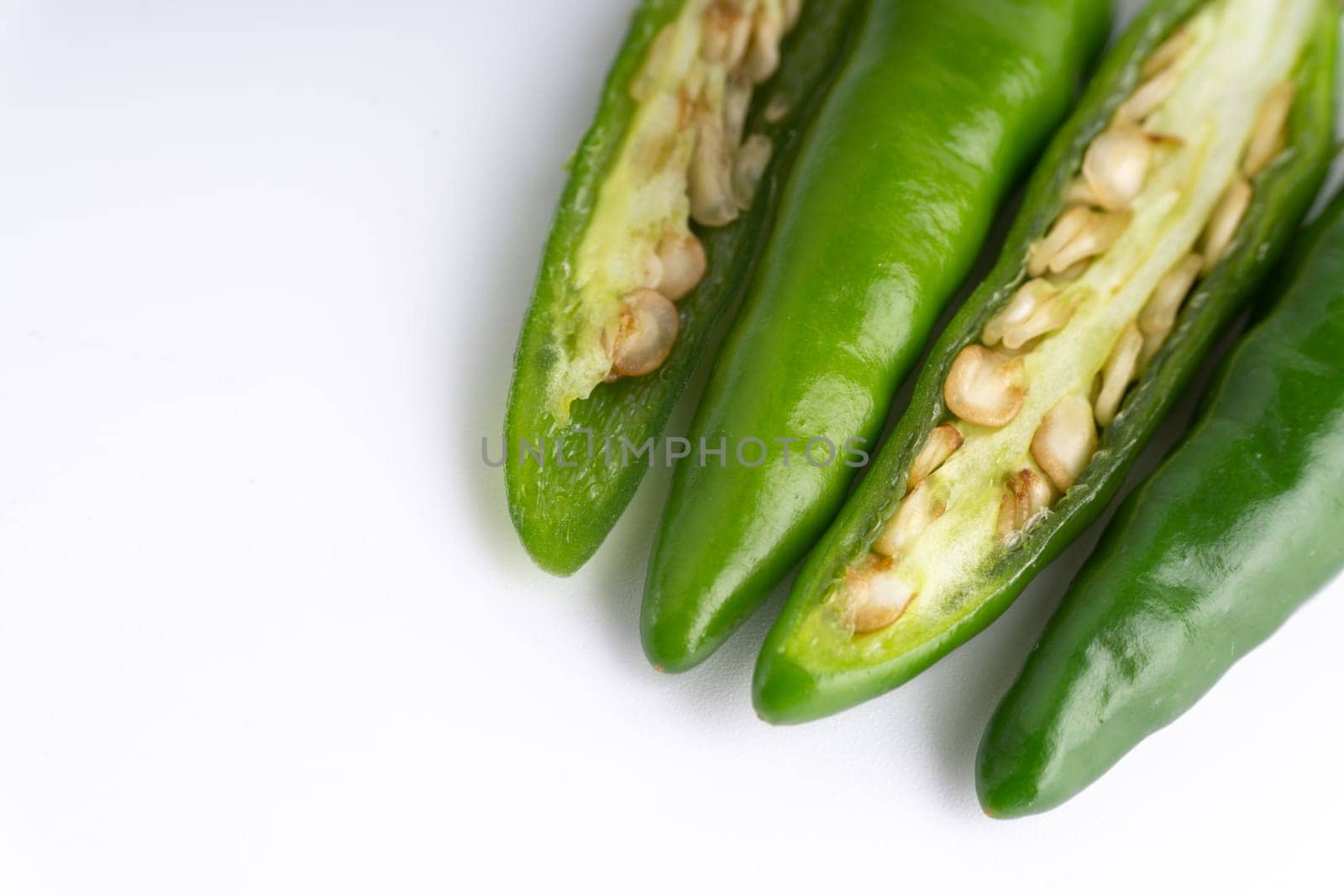 Green Bird’s eye chili,Thai Chili pepper ,bird chili pepper nature isolate on white background. Selective focus and crop fragment