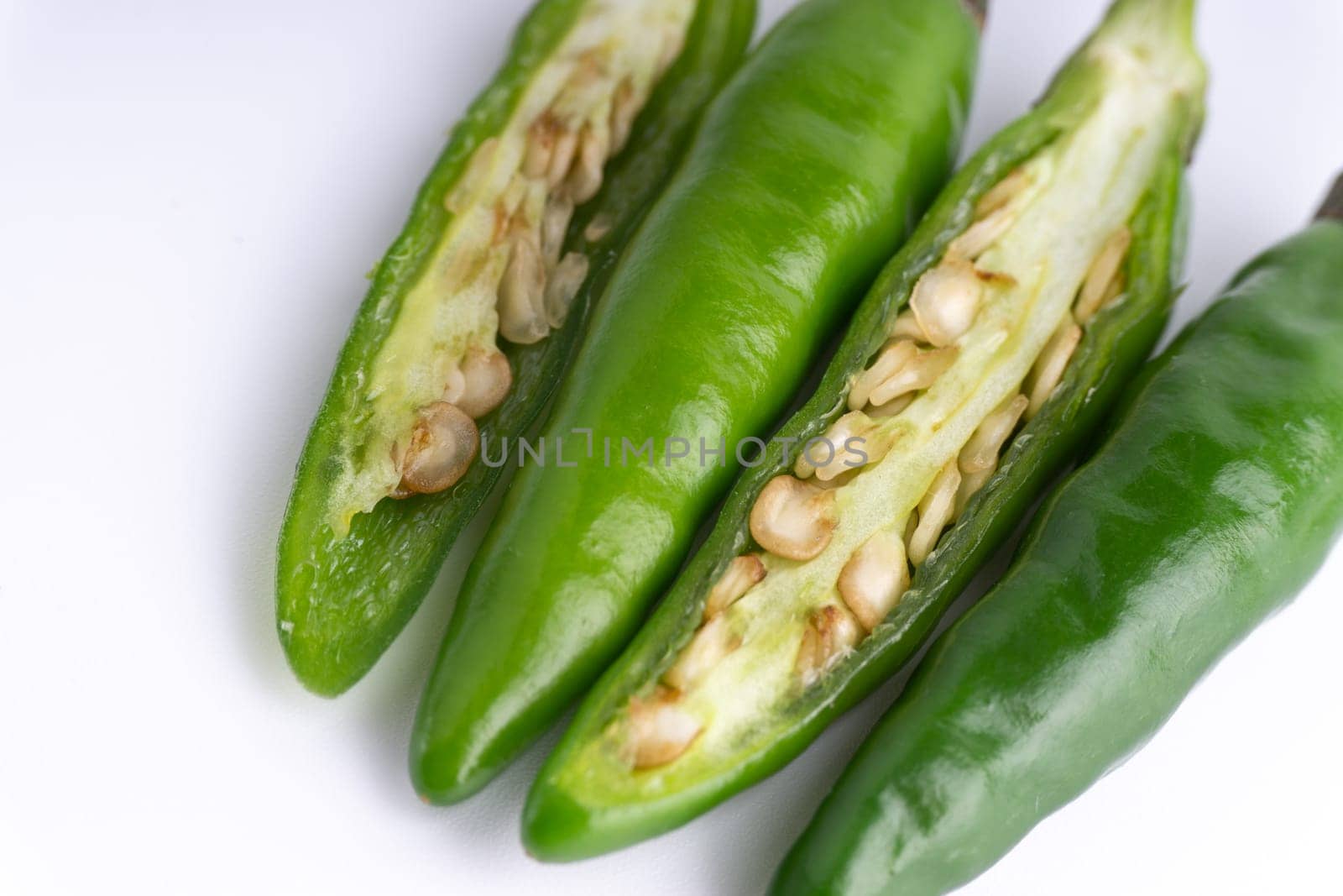 Green Bird’s eye chili,Thai Chili pepper ,bird chili pepper nature isolate on white background. Selective focus and crop fragment