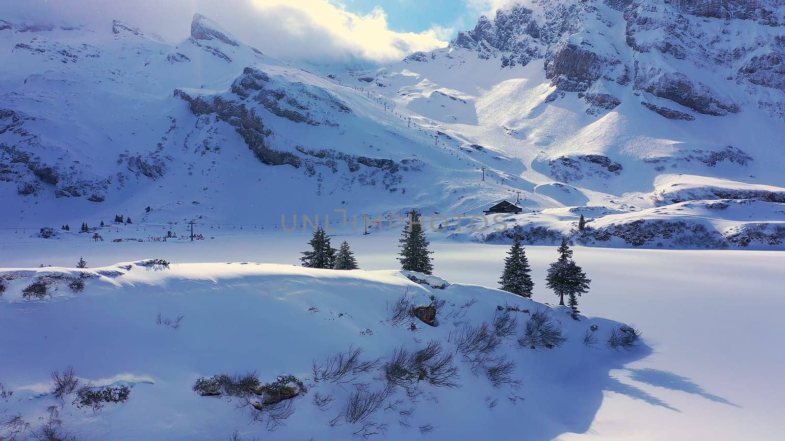 Beautiful sunny winterÂ´s day in the alps with snow capped mountains - aerial drone footage - aerial photography