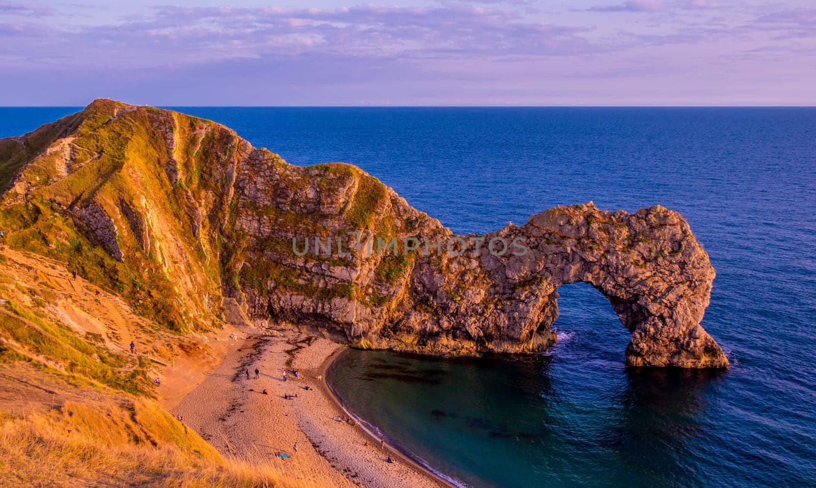 Sunset over Durdle Door - the most famous landmark in Devon England