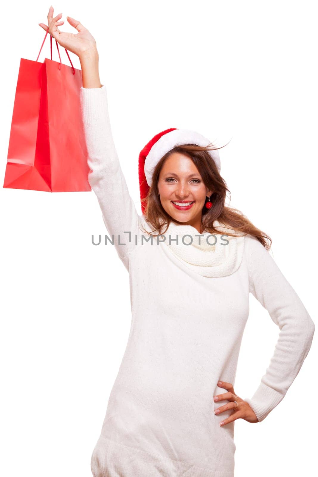 Attractive young woman with Santa hat holds laughing a red shopping bag sale final sale in hand on white background with text free space Insulated freeholder
