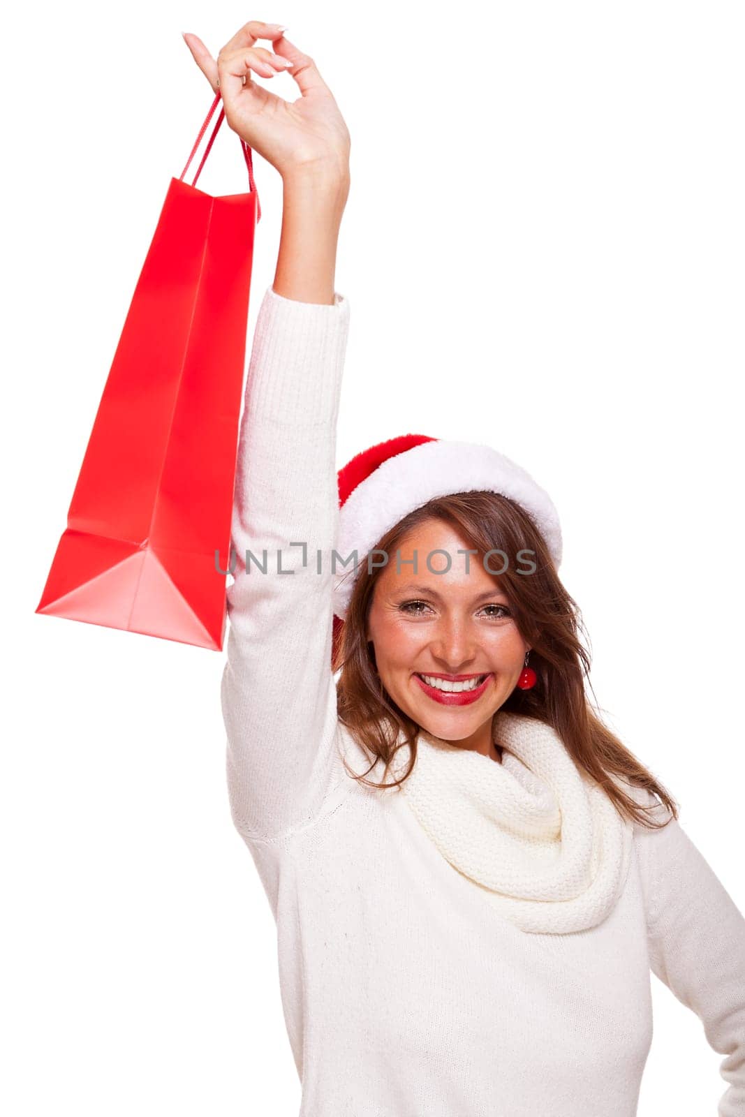 Attractive young woman with Santa hat holds laughing a red shopping bag sale final sale in hand on white background with text free space Insulated freeholder