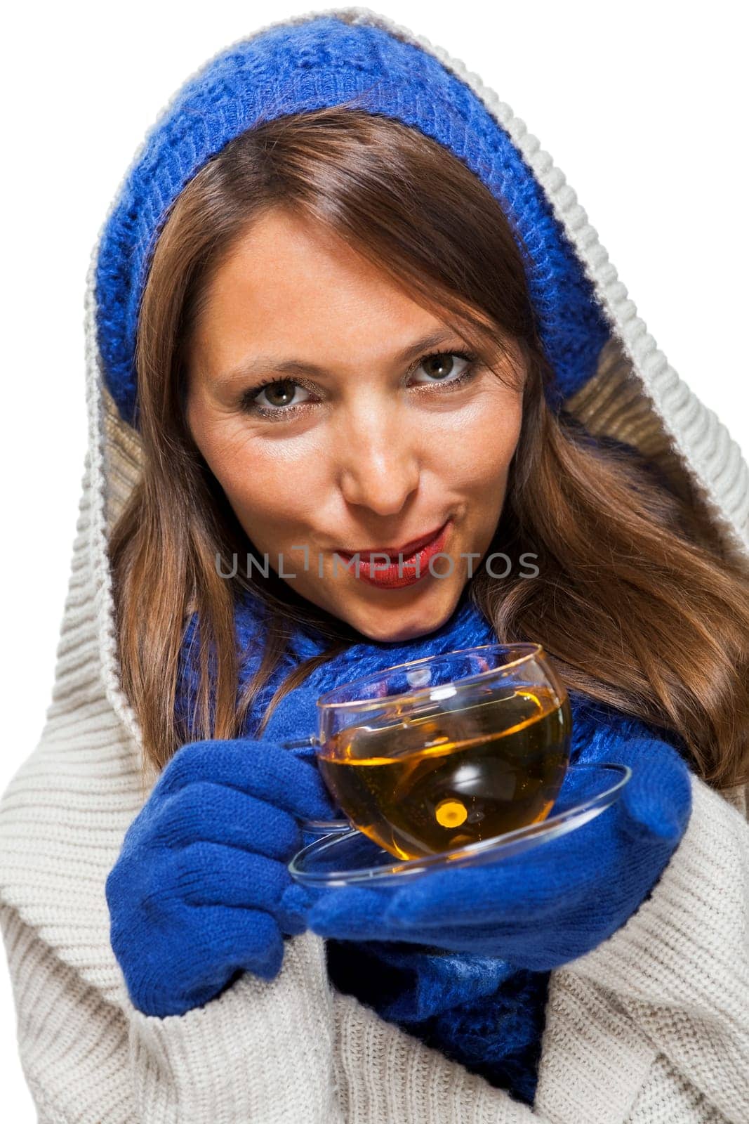 Young woman with dark hair and blue wool lyant drink a cup of tea to be isolated on white background
