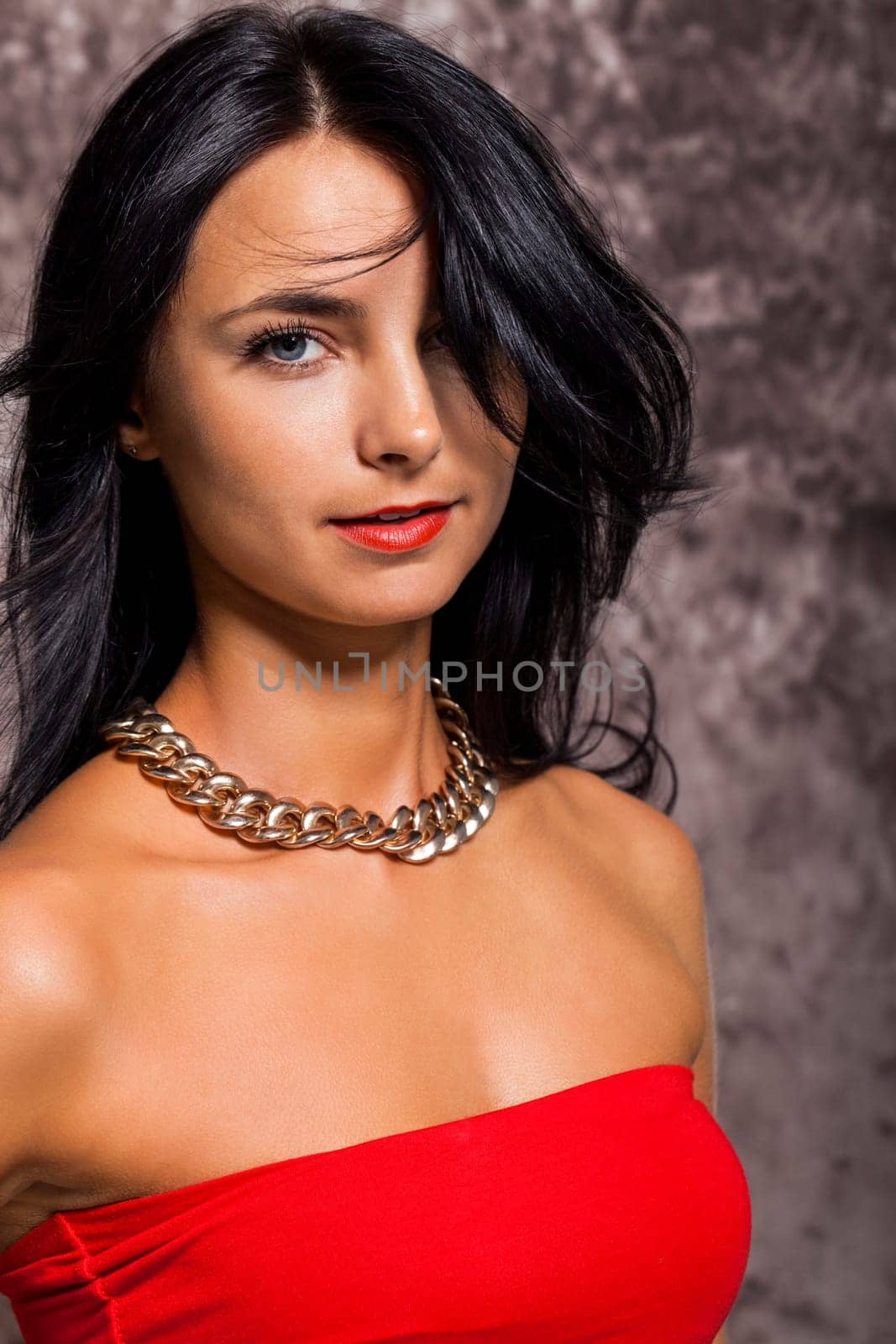 Young pretty girl woman with long black hair in red top as portrait with text space