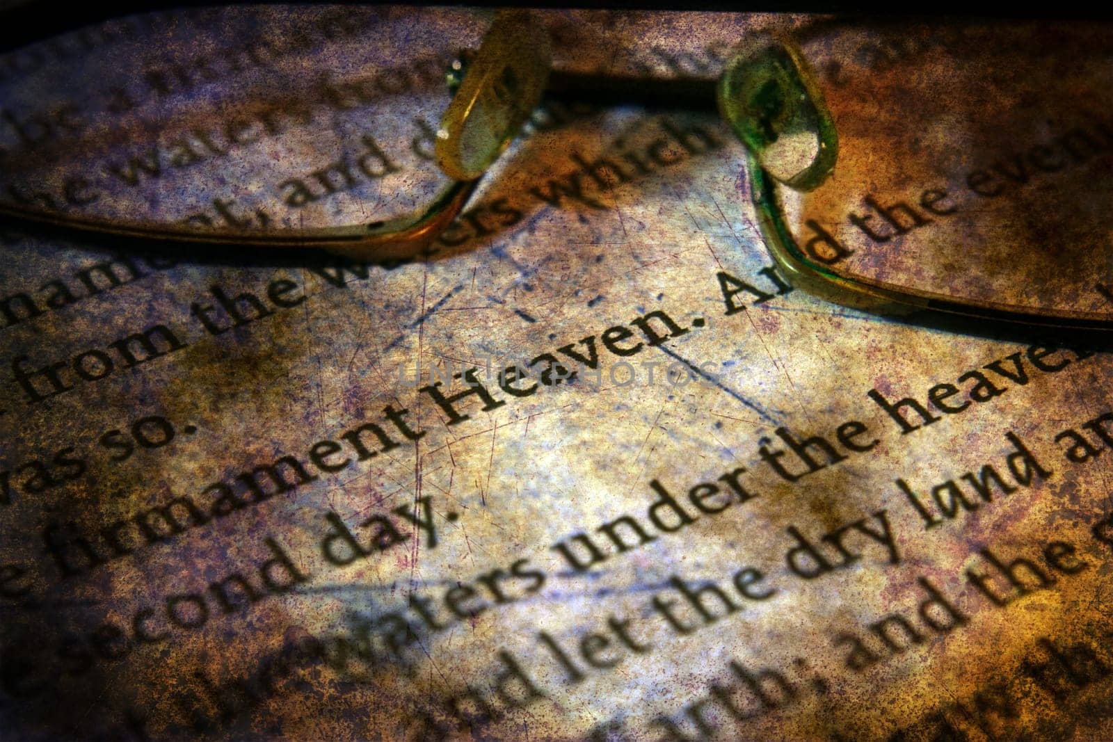 Reading  glasses on bible grunge concept