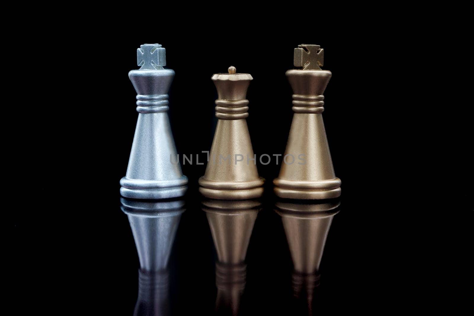 Stacking Piece of chess, king and queen with reflection glass on black background.