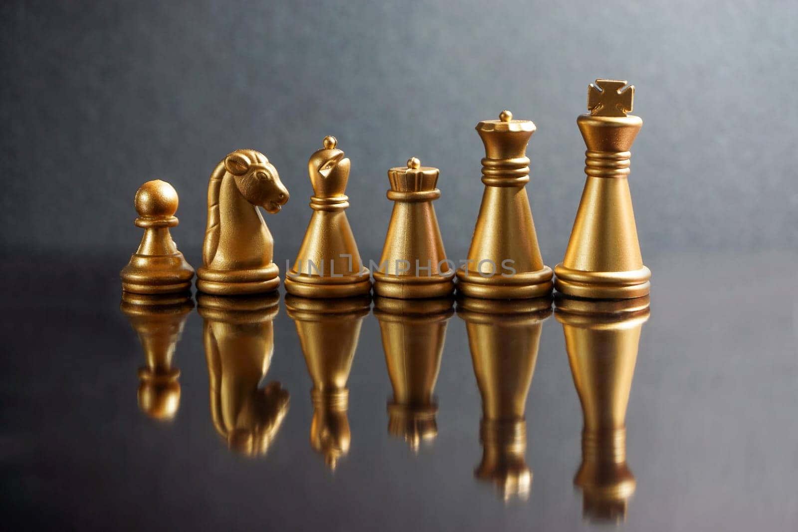Stacking Piece of chess, king, queen, knight, castle, bishop and  pawn or apieces with reflection glass on black background. Chess game, business, competition, leadership and success concept