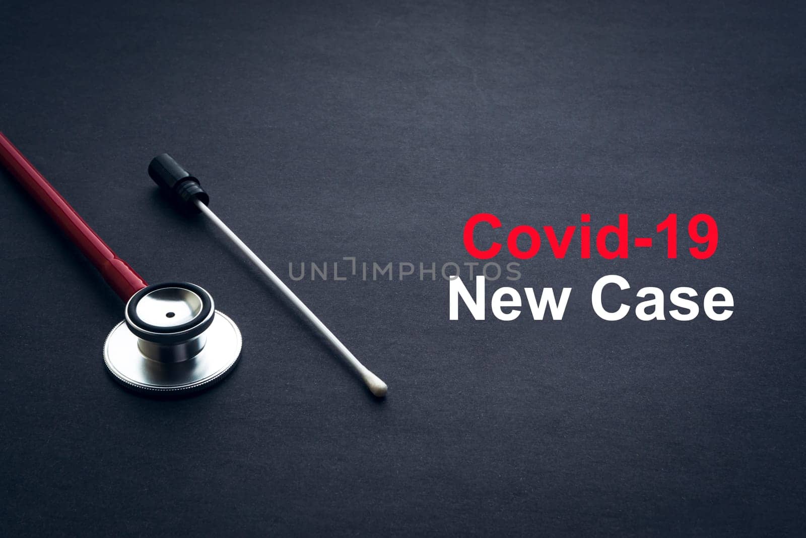 COVID-19 or CORONAVIRUS NEW CASE text with stethoscope and medical swab on black background. Covid-19 or Coronavirus concept.