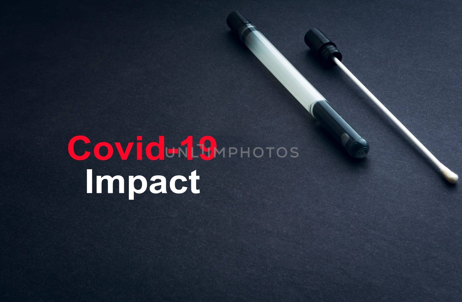 COVID-19 or CORONAVIRUS IMPACT text with medical swab on black background. Covid-19 or Coronavirus concept.