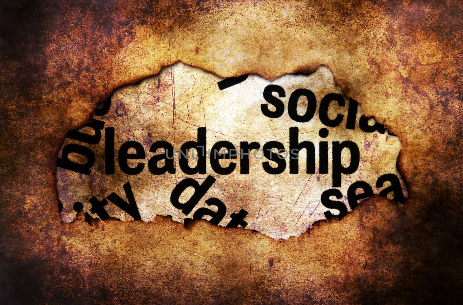 Leadership text on paper hole grunge concept
