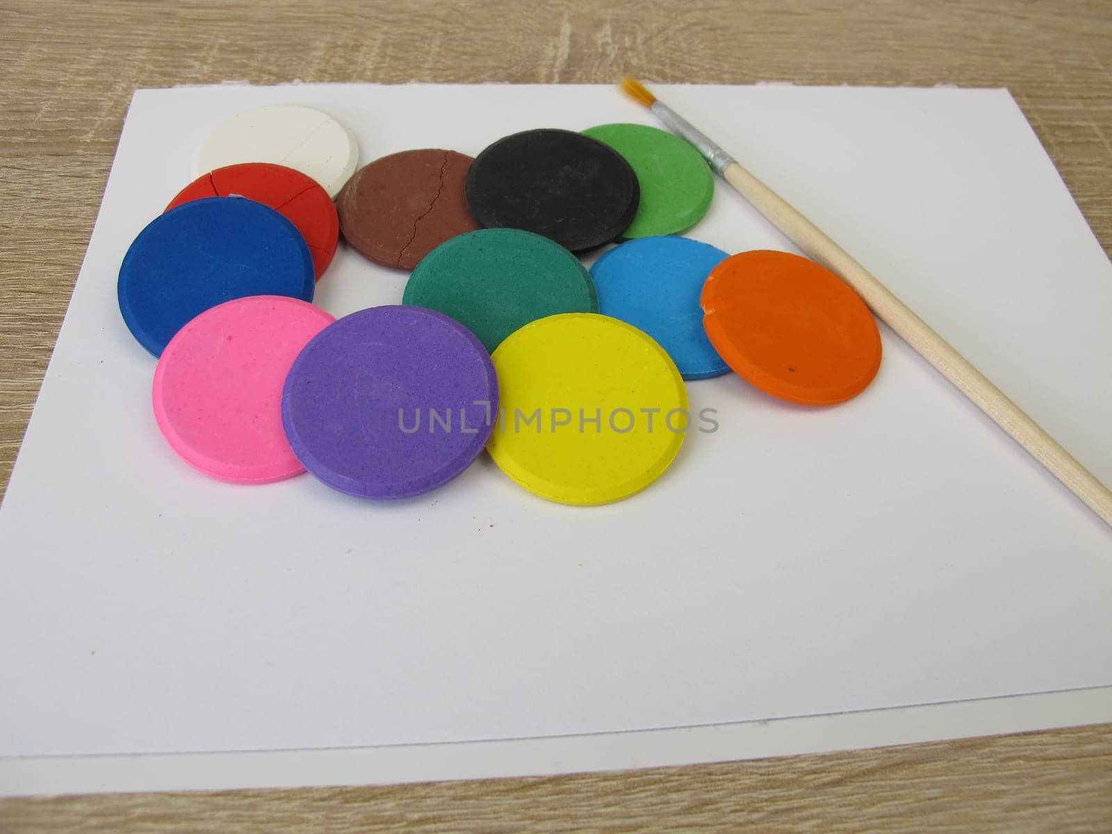 Water-soluble watercolor color tablets - Colorful watercolor, a drawing pad and a brush