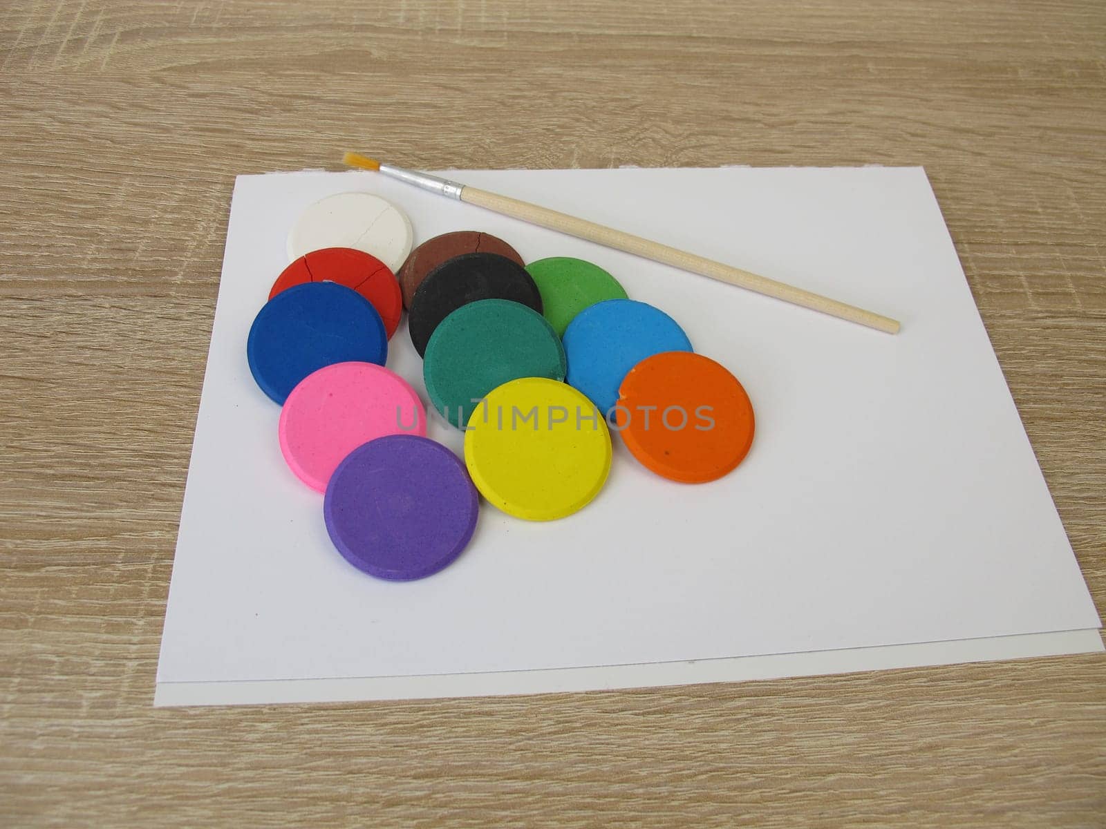 Water-soluble watercolor color tablets - Colorful watercolor, a drawing pad and a brush