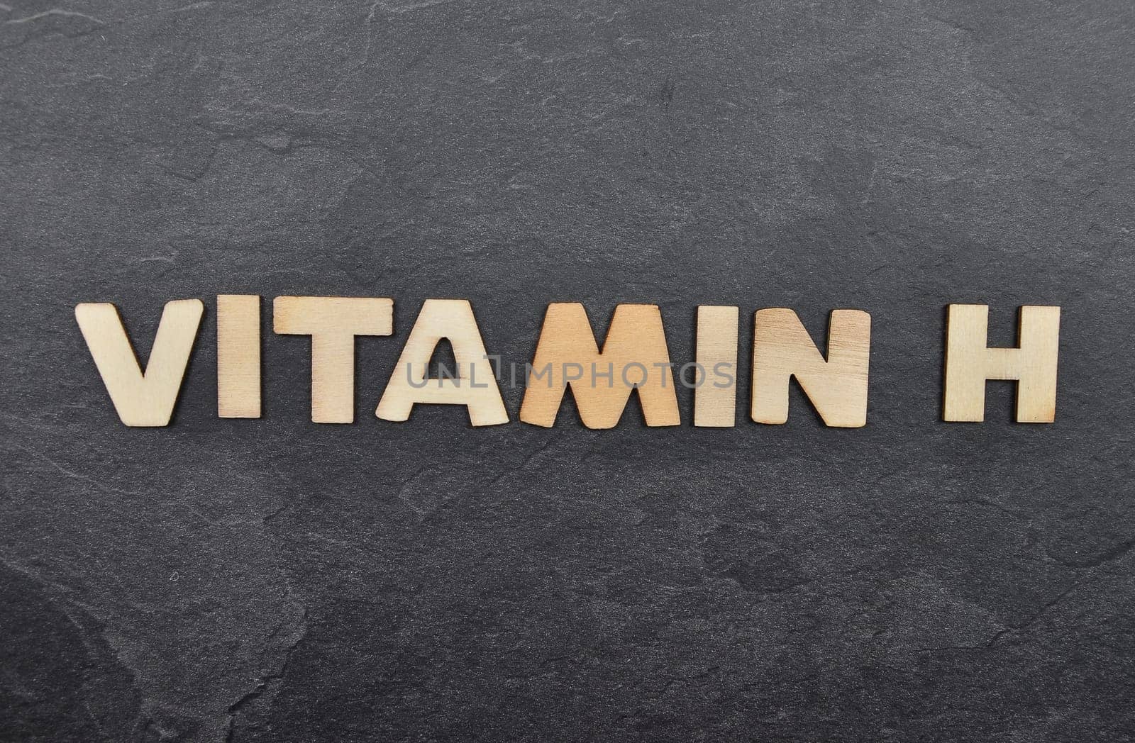 Term from wooden letters on slate board