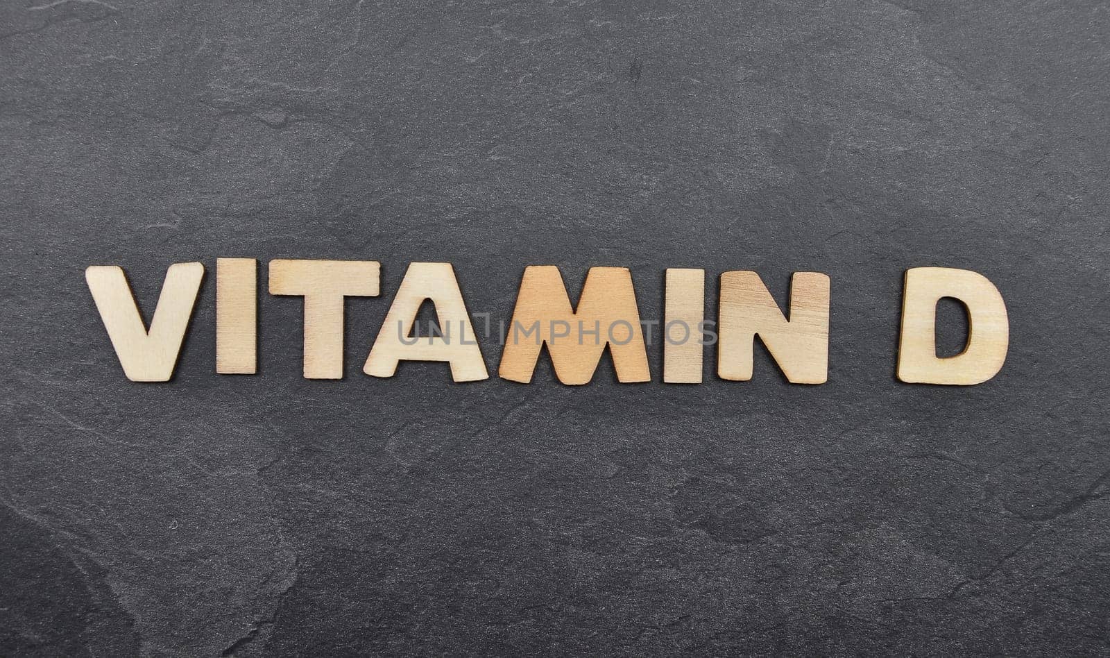 Term from wooden letters on slate board