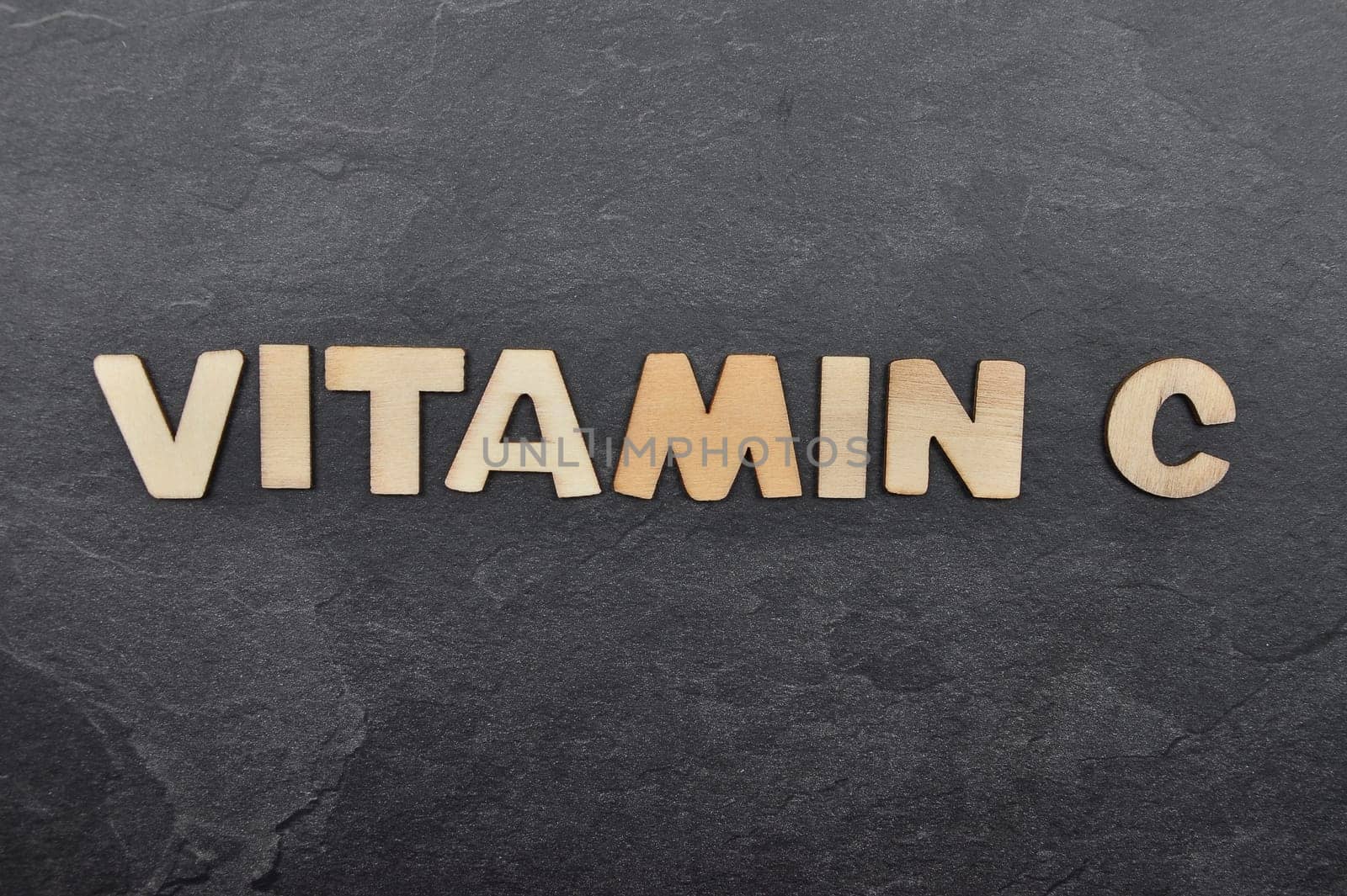 Term from wooden letters on slate board