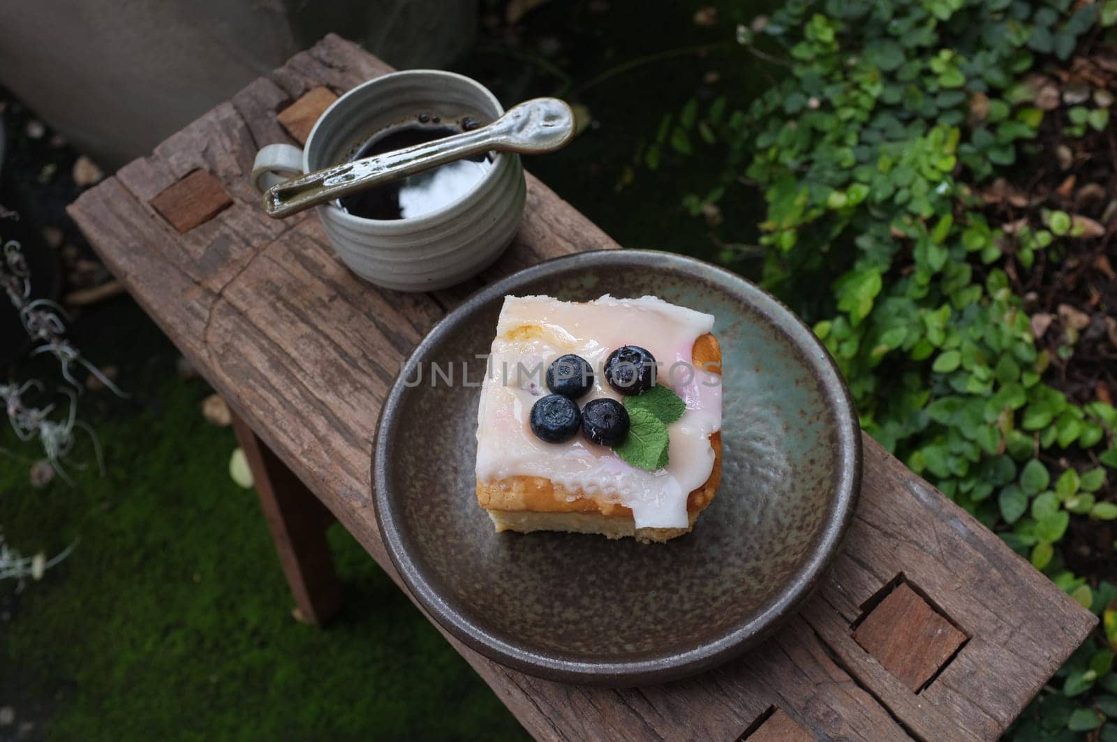 Coffee with piece of cake on wooden table , Concept Relax time, Copy space. Place for text.
