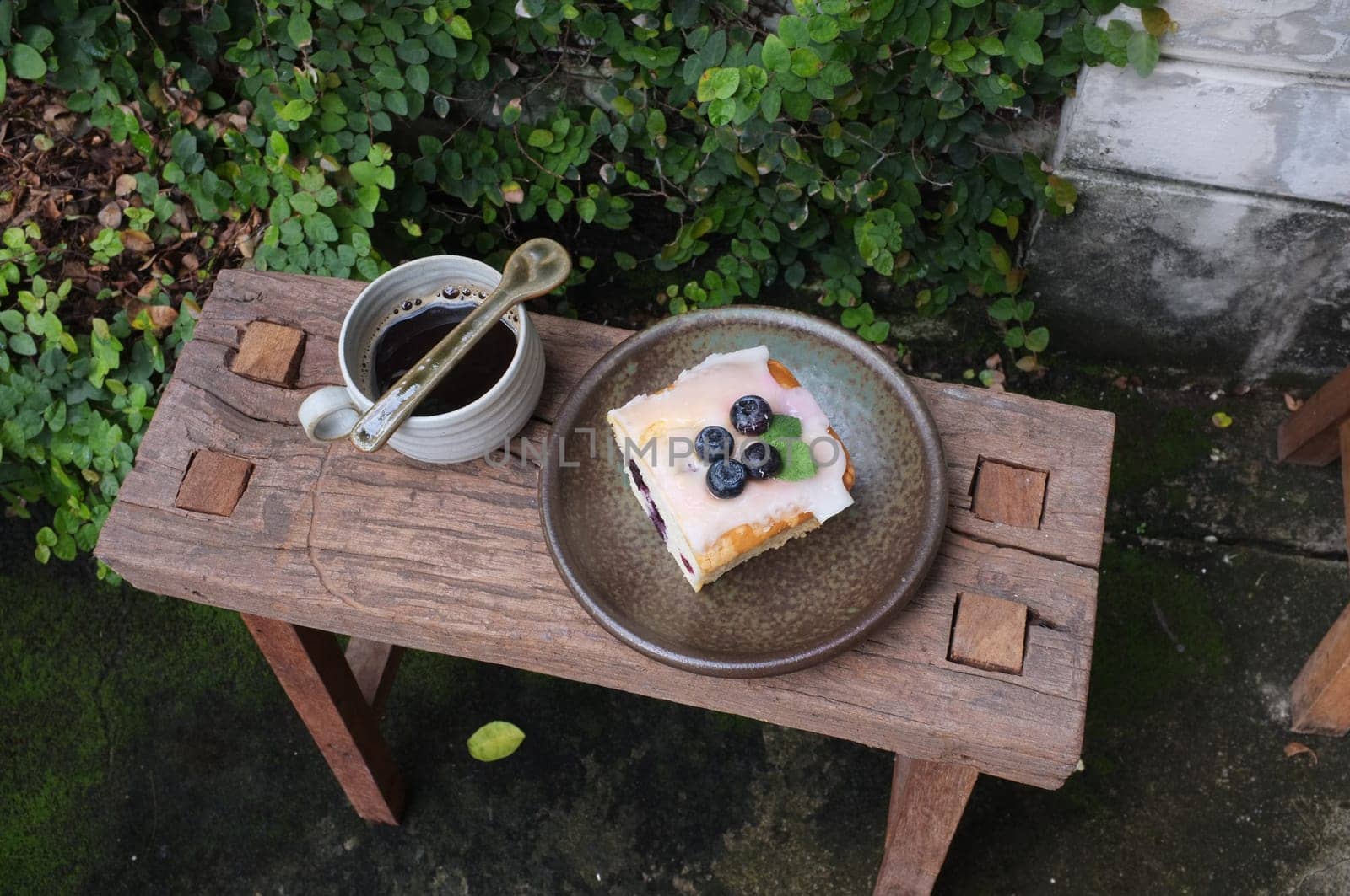 Coffee with piece of cake on wooden table , Concept Relax time, Copy space. Place for text.
