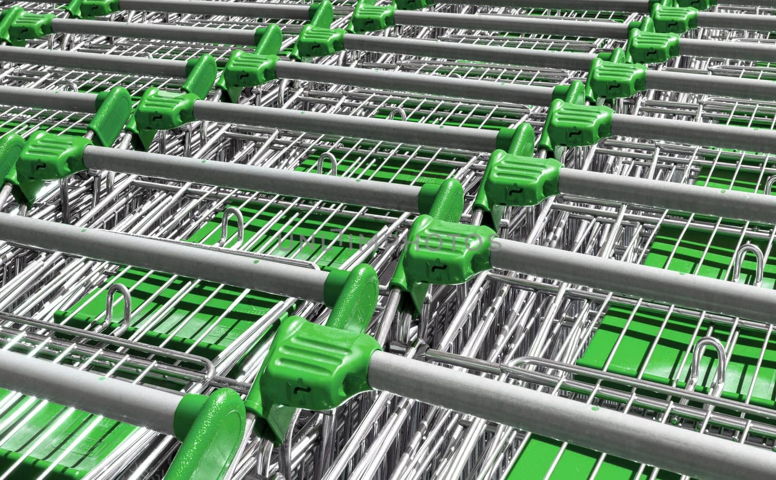 Green shopping trolleys in a superstore