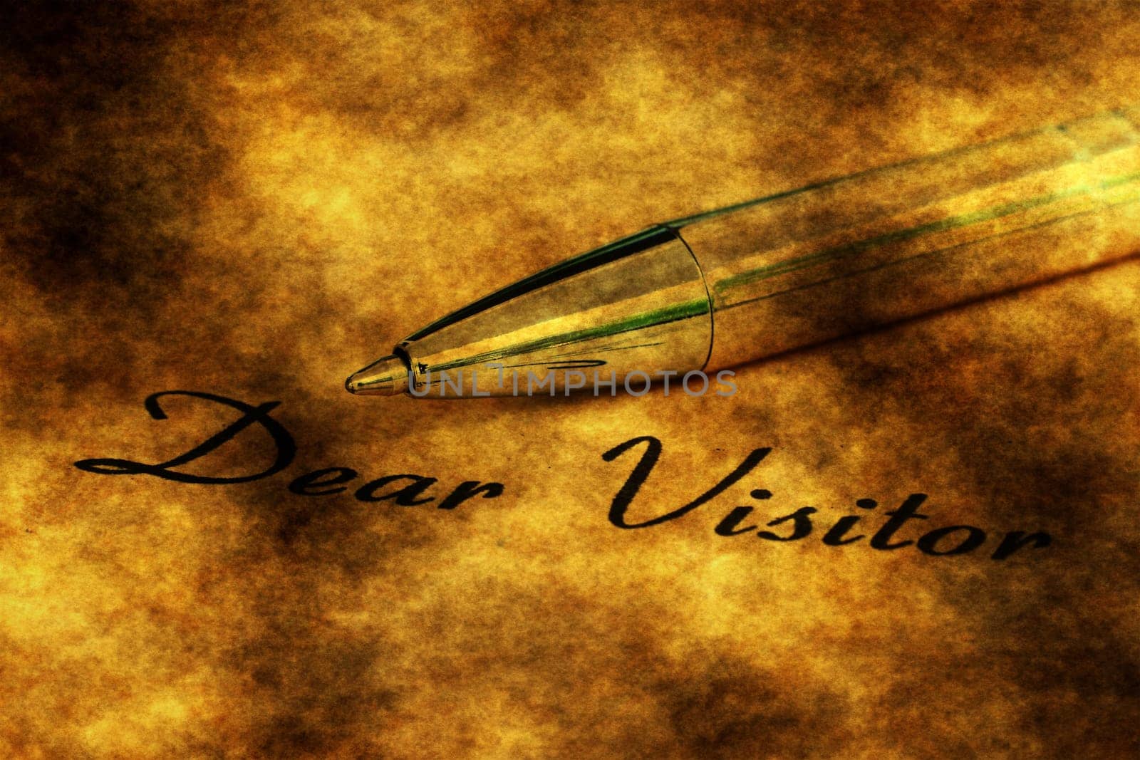 Fountain pen on dear visitor text