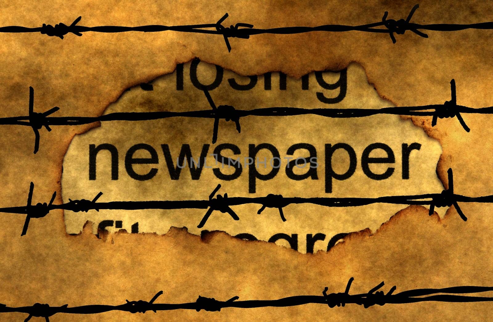 Newspaper text on paper hole against barbwire