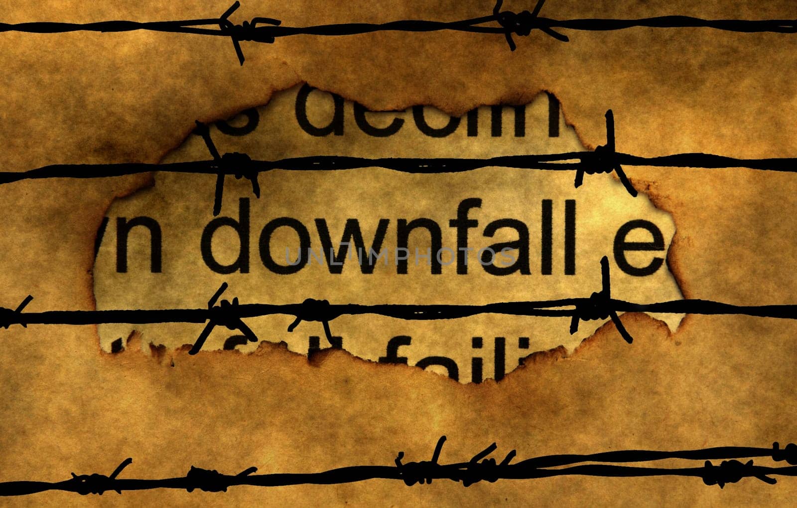 Downfall text on paper hole against barbwire