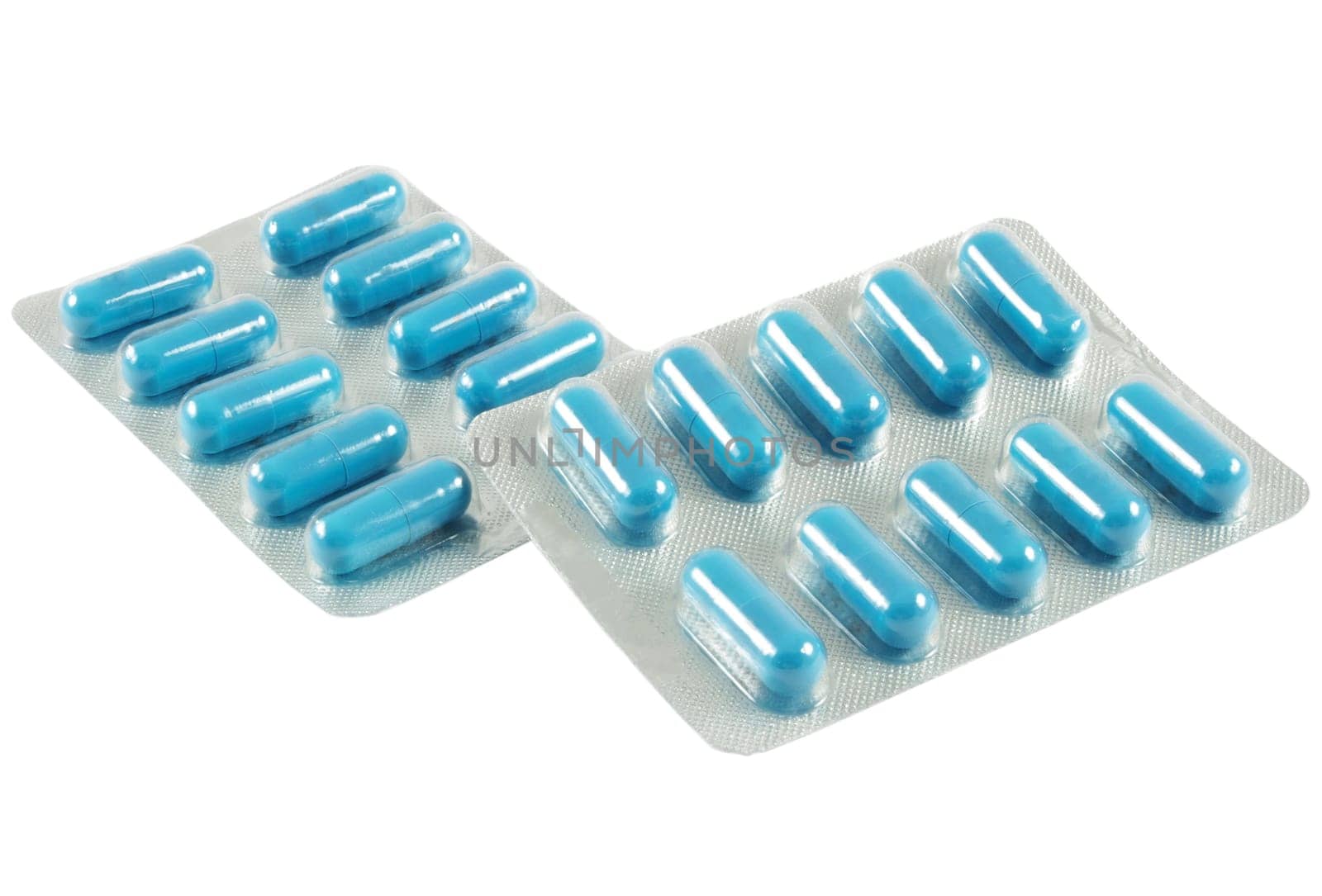 Blue antibiotic pills on white background