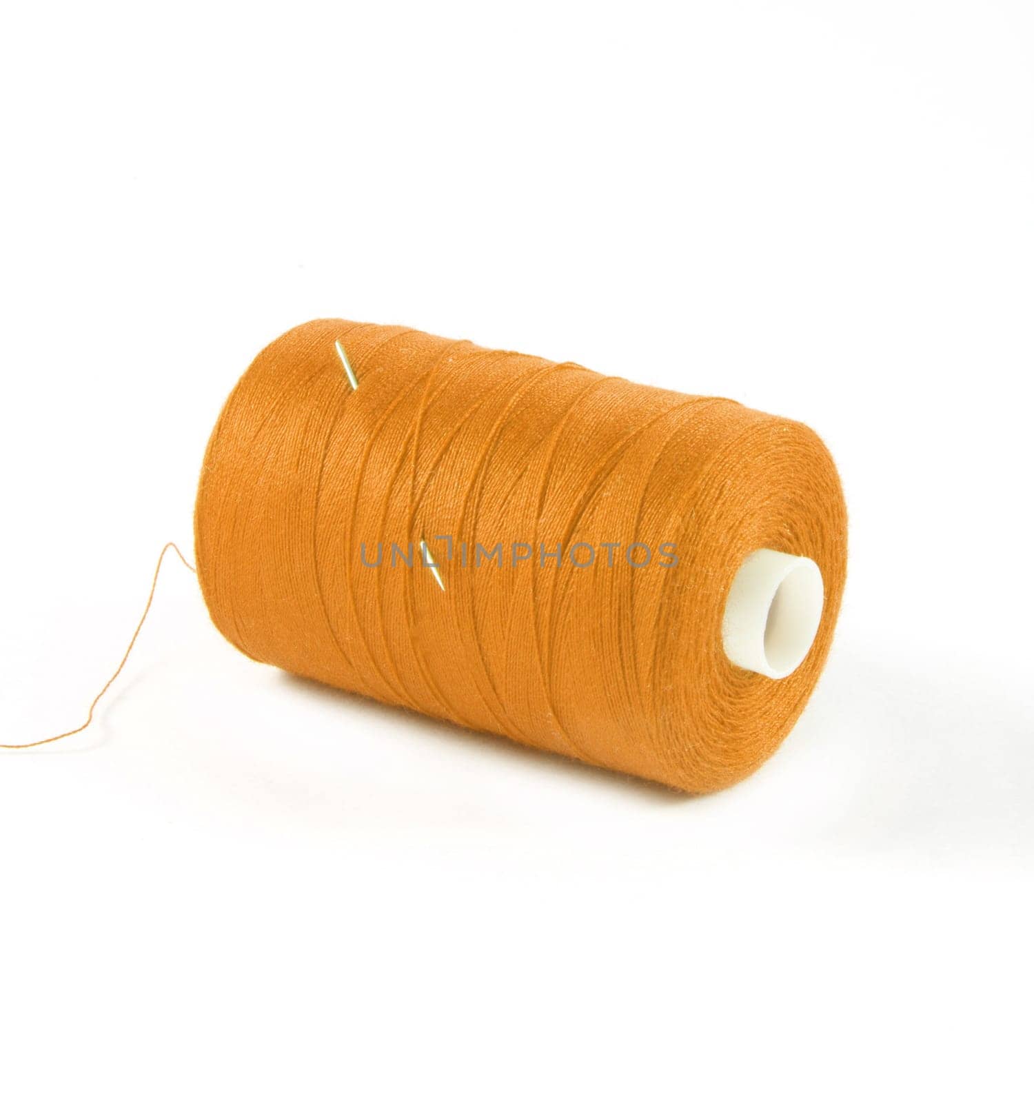 orange threads over white surface