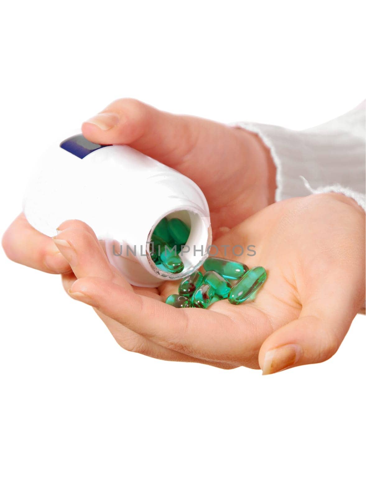 female hand with medicine pills on white
