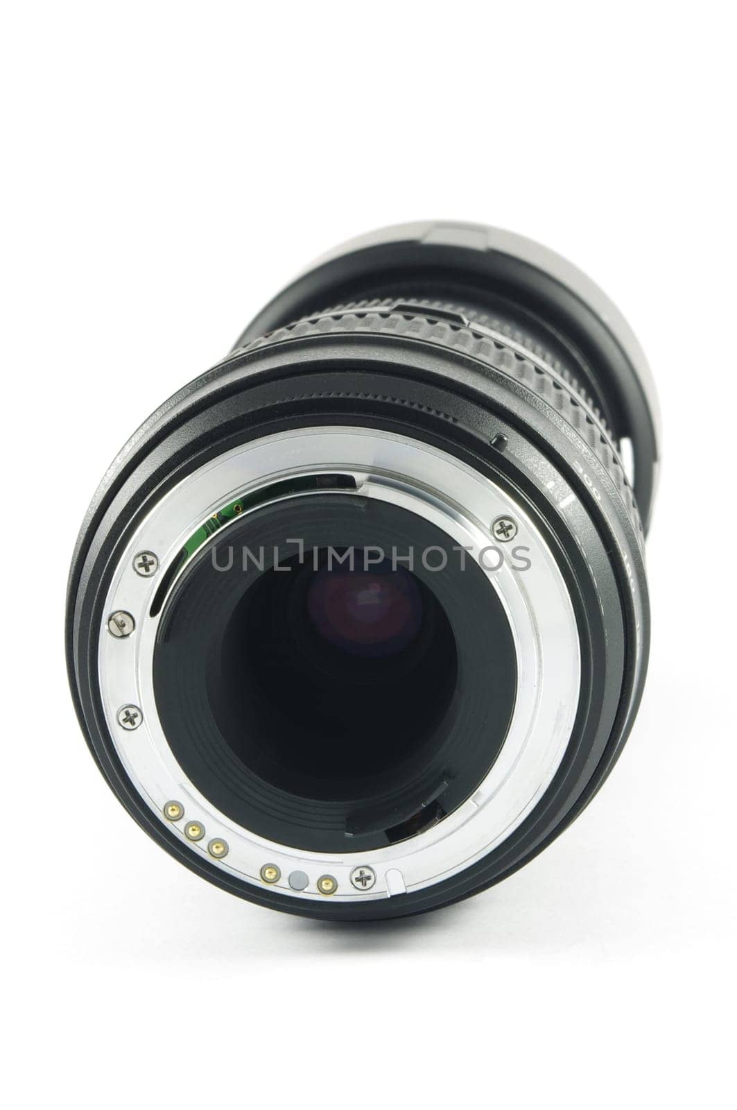 Camera lens  lying on the white surface.Back view