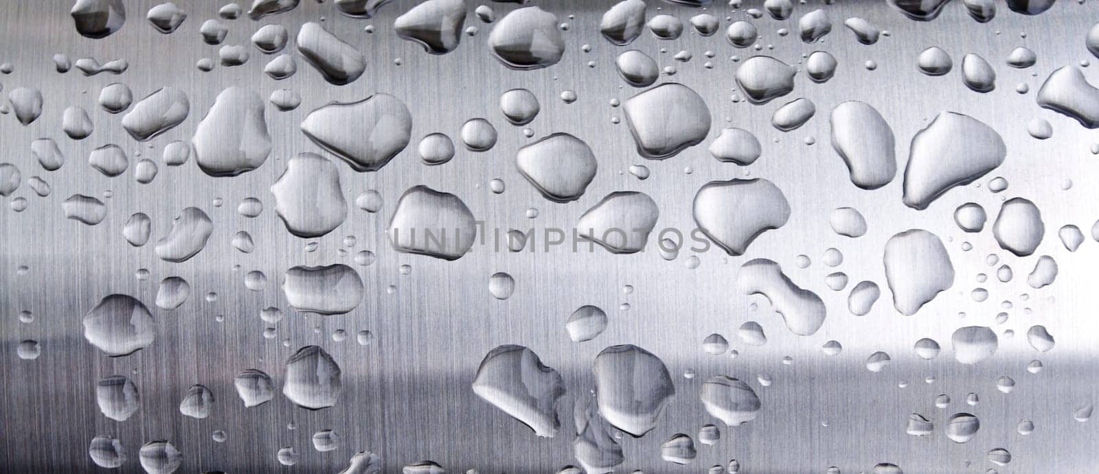 closeup of metalic texture with water drops