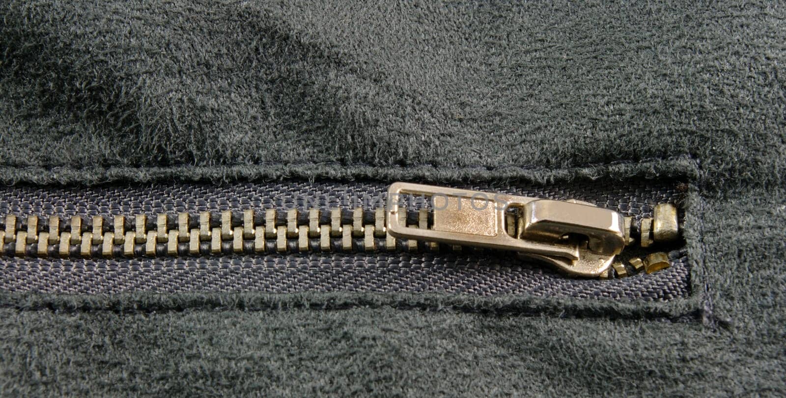 zipper closeup on grey cloth
