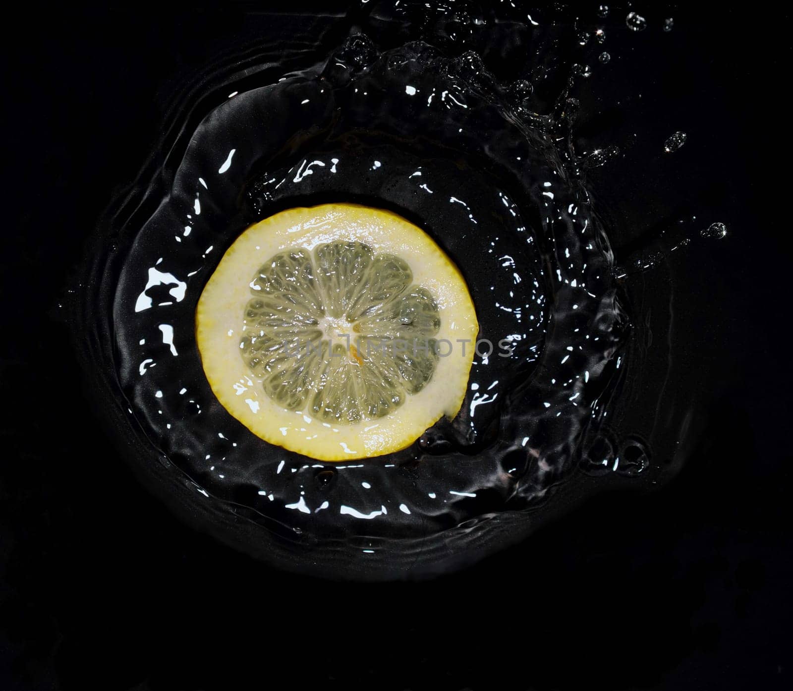 lemon falling into water