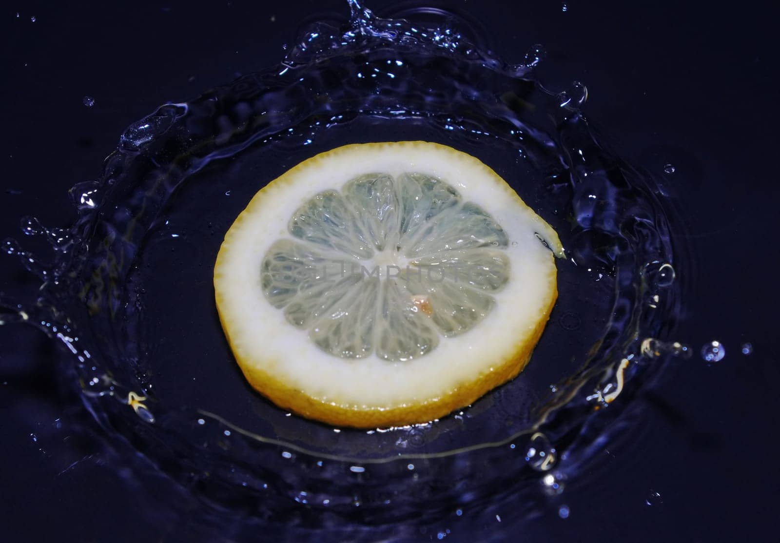 lemon falling into water