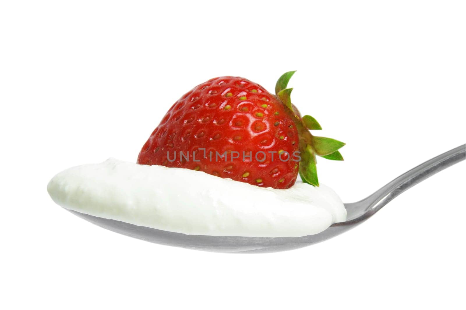 strawberry with cream on the spoon over white