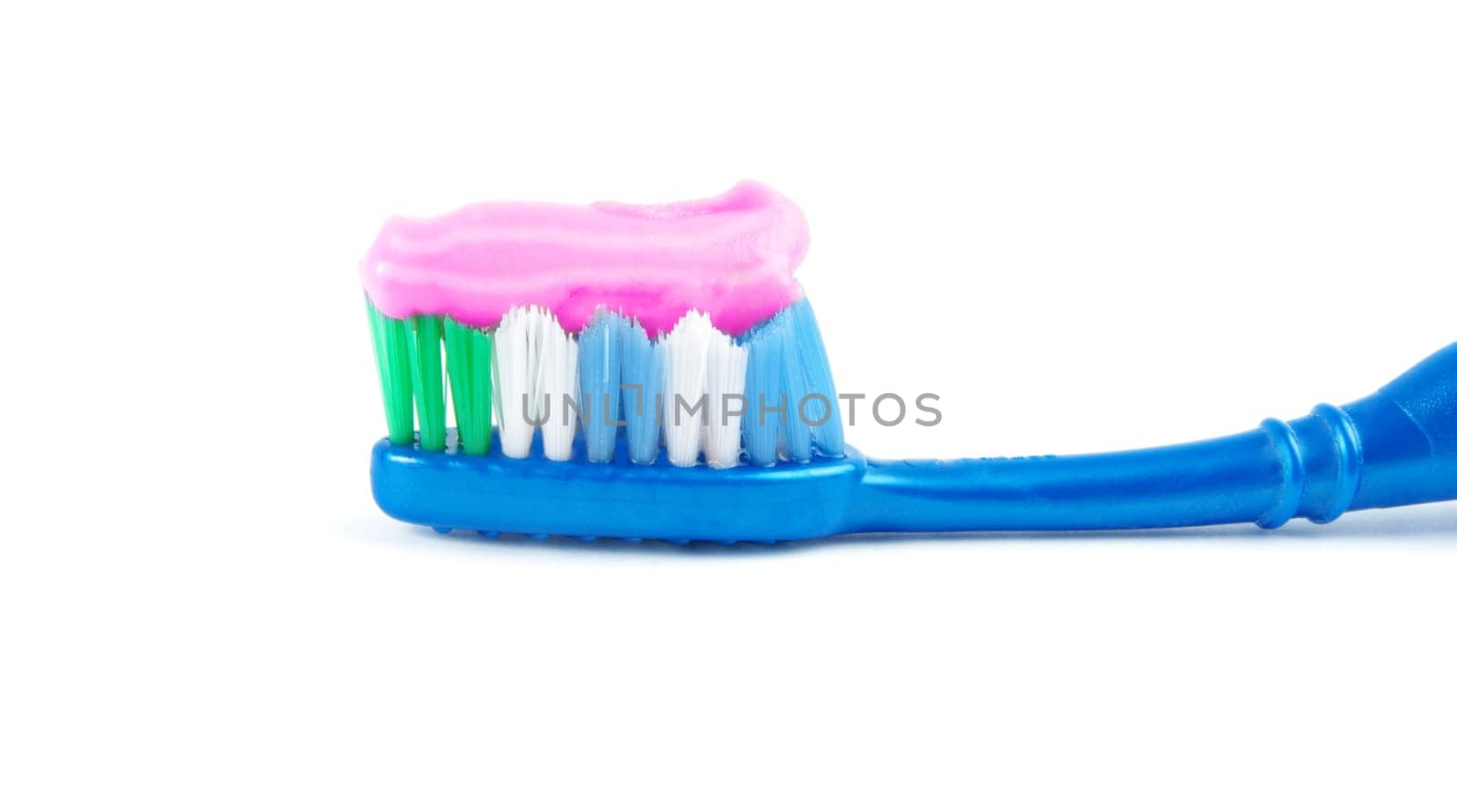 brush and toothpaste isolated on white