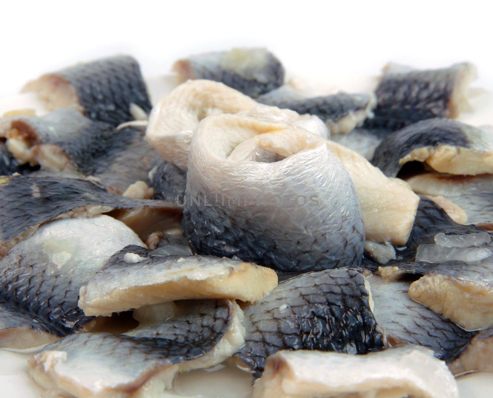marinanated fish pieces on plate