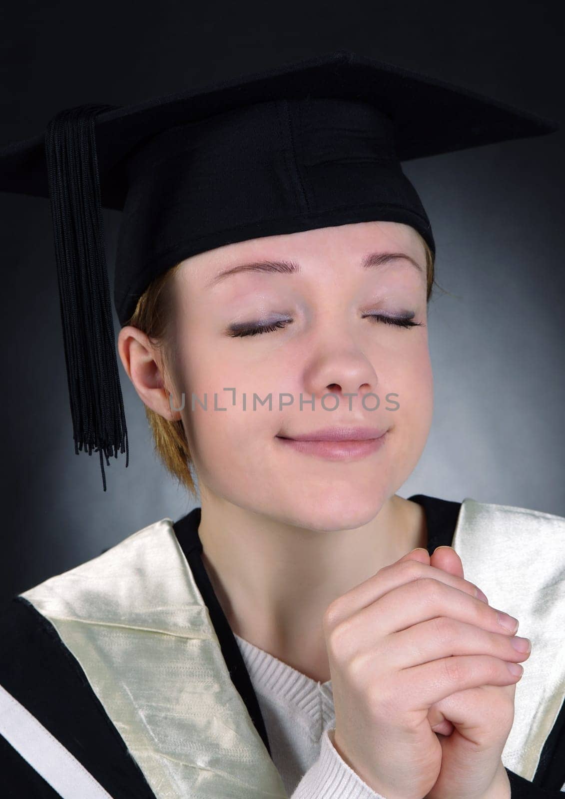 graduated girl with hat closeup